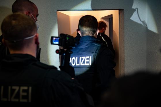 German police conduct raids on climate activists as impatience mounts